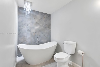 Welcome to this beautifully renovated 3-bed, 2.5-bath townhome on The Boca Country Club in Florida - for sale on GolfHomes.com, golf home, golf lot