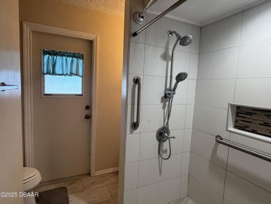 Experience Florida living with a tranquil setting in this on Daytona Beach Golf Club in Florida - for sale on GolfHomes.com, golf home, golf lot