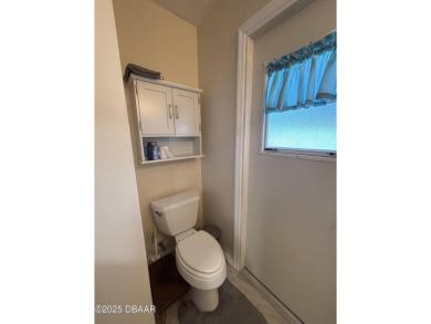 Experience Florida living with a tranquil setting in this on Daytona Beach Golf Club in Florida - for sale on GolfHomes.com, golf home, golf lot