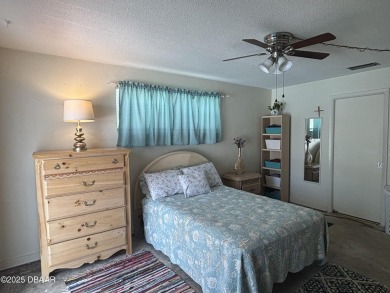 Experience Florida living with a tranquil setting in this on Daytona Beach Golf Club in Florida - for sale on GolfHomes.com, golf home, golf lot