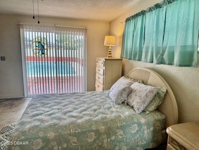 Experience Florida living with a tranquil setting in this on Daytona Beach Golf Club in Florida - for sale on GolfHomes.com, golf home, golf lot