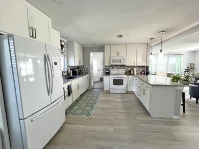 This stunning, renovated, stucco 2/bd, 2/ba home is a perfect on Del Tura Golf and Country Club in Florida - for sale on GolfHomes.com, golf home, golf lot