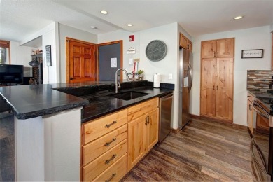 Absolutely gorgeous vistas of the Ten Mile Range from this 2 bed on The River Course At Keystone in Colorado - for sale on GolfHomes.com, golf home, golf lot