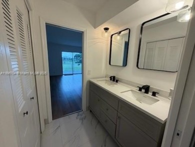 Newly renovated unit is a must see featuring a beautiful view of on Atlantis Golf Club in Florida - for sale on GolfHomes.com, golf home, golf lot