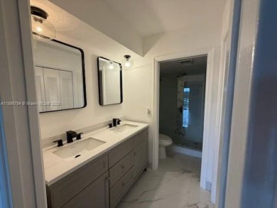 Newly renovated unit is a must see featuring a beautiful view of on Atlantis Golf Club in Florida - for sale on GolfHomes.com, golf home, golf lot