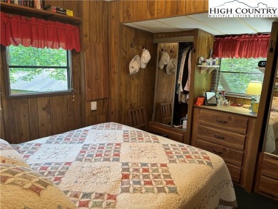 Escape to your own seasonal retreat in a vibrant, amenity-rich on Land Harbor Golf Course in North Carolina - for sale on GolfHomes.com, golf home, golf lot