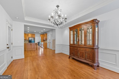 Step inside to find gleaming hardwood floors throughout the main on Chapel Hills Golf and Country Club in Georgia - for sale on GolfHomes.com, golf home, golf lot