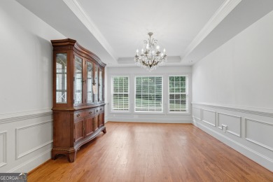 Step inside to find gleaming hardwood floors throughout the main on Chapel Hills Golf and Country Club in Georgia - for sale on GolfHomes.com, golf home, golf lot