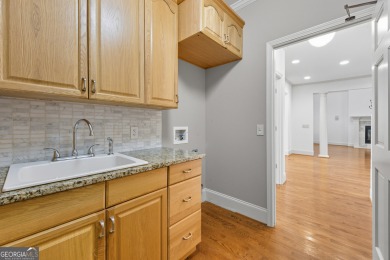 Step inside to find gleaming hardwood floors throughout the main on Chapel Hills Golf and Country Club in Georgia - for sale on GolfHomes.com, golf home, golf lot