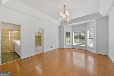 Step inside to find gleaming hardwood floors throughout the main on Chapel Hills Golf and Country Club in Georgia - for sale on GolfHomes.com, golf home, golf lot