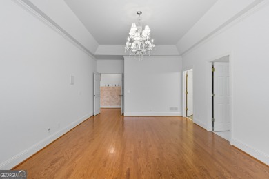 Step inside to find gleaming hardwood floors throughout the main on Chapel Hills Golf and Country Club in Georgia - for sale on GolfHomes.com, golf home, golf lot