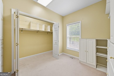 Step inside to find gleaming hardwood floors throughout the main on Chapel Hills Golf and Country Club in Georgia - for sale on GolfHomes.com, golf home, golf lot