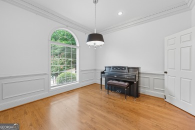 Step inside to find gleaming hardwood floors throughout the main on Chapel Hills Golf and Country Club in Georgia - for sale on GolfHomes.com, golf home, golf lot