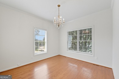Step inside to find gleaming hardwood floors throughout the main on Chapel Hills Golf and Country Club in Georgia - for sale on GolfHomes.com, golf home, golf lot