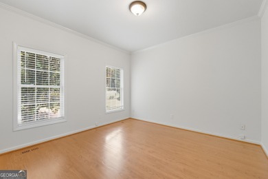 Step inside to find gleaming hardwood floors throughout the main on Chapel Hills Golf and Country Club in Georgia - for sale on GolfHomes.com, golf home, golf lot