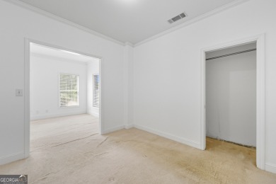 Step inside to find gleaming hardwood floors throughout the main on Chapel Hills Golf and Country Club in Georgia - for sale on GolfHomes.com, golf home, golf lot