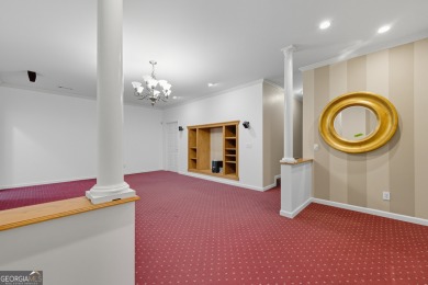 Step inside to find gleaming hardwood floors throughout the main on Chapel Hills Golf and Country Club in Georgia - for sale on GolfHomes.com, golf home, golf lot