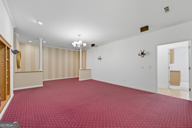 Step inside to find gleaming hardwood floors throughout the main on Chapel Hills Golf and Country Club in Georgia - for sale on GolfHomes.com, golf home, golf lot