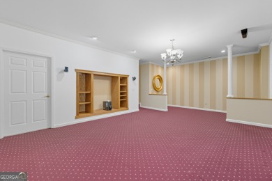 Step inside to find gleaming hardwood floors throughout the main on Chapel Hills Golf and Country Club in Georgia - for sale on GolfHomes.com, golf home, golf lot