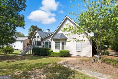 Step inside to find gleaming hardwood floors throughout the main on Chapel Hills Golf and Country Club in Georgia - for sale on GolfHomes.com, golf home, golf lot
