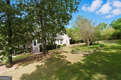 Step inside to find gleaming hardwood floors throughout the main on Chapel Hills Golf and Country Club in Georgia - for sale on GolfHomes.com, golf home, golf lot