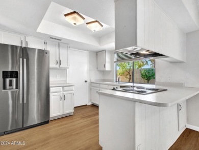 Step into this welcoming single-level townhome nestled in the on Bellaire Golf Club in Arizona - for sale on GolfHomes.com, golf home, golf lot