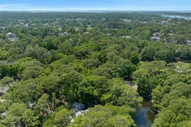 Nestled amidst stunning landscapes adorned with majestic trees on Long Cove Club in South Carolina - for sale on GolfHomes.com, golf home, golf lot