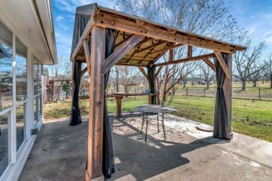 Discover this beautifully upgraded 3-bedroom, 2-bath home in the on Pecan Plantation Country Club in Texas - for sale on GolfHomes.com, golf home, golf lot