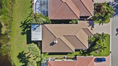 This meticulously maintained residence offers extensive updates on Santa Lucia River Club in Florida - for sale on GolfHomes.com, golf home, golf lot