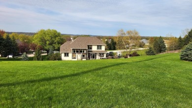 Location, location,location! This property backs up to a mature on Western Lakes Golf Club in Wisconsin - for sale on GolfHomes.com, golf home, golf lot