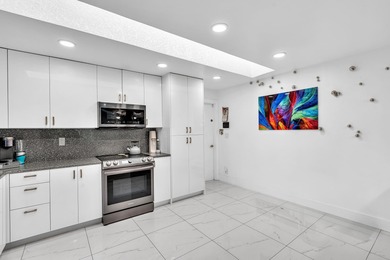 Beautifully renovated one story home featuring a modern open on Boca Greens Country Club in Florida - for sale on GolfHomes.com, golf home, golf lot