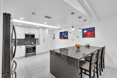 Beautifully renovated one story home featuring a modern open on Boca Greens Country Club in Florida - for sale on GolfHomes.com, golf home, golf lot