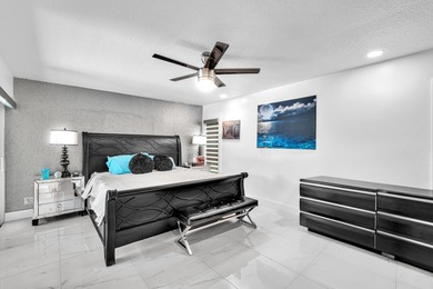 Beautifully renovated one story home featuring a modern open on Boca Greens Country Club in Florida - for sale on GolfHomes.com, golf home, golf lot