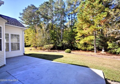 This home truly has it all -comfort, style and a prime location on Sandpiper Bay Golf and Country Club in North Carolina - for sale on GolfHomes.com, golf home, golf lot