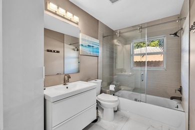 Beautifully renovated one story home featuring a modern open on Boca Greens Country Club in Florida - for sale on GolfHomes.com, golf home, golf lot
