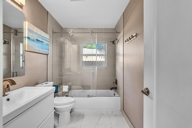 Beautifully renovated one story home featuring a modern open on Boca Greens Country Club in Florida - for sale on GolfHomes.com, golf home, golf lot