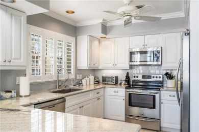 This top floor end unit apartment has been tastefully updated on Grand Harbor Golf and Country Club in Florida - for sale on GolfHomes.com, golf home, golf lot