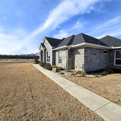 Discover this stunning 2022 custom-built home nestled in the on White Bluff Resort - New Course in Texas - for sale on GolfHomes.com, golf home, golf lot