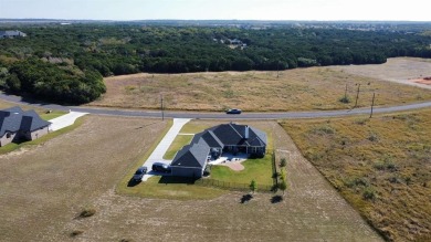 Discover this stunning 2022 custom-built home nestled in the on White Bluff Resort - New Course in Texas - for sale on GolfHomes.com, golf home, golf lot