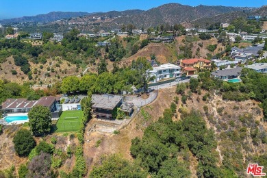 180 degree VIEWS of the mountains, city and ocean! Ideally on Bel-Air Country Club in California - for sale on GolfHomes.com, golf home, golf lot