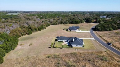 Discover this stunning 2022 custom-built home nestled in the on White Bluff Resort - New Course in Texas - for sale on GolfHomes.com, golf home, golf lot