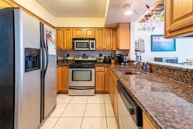 Step into paradise with this stunning 2-bedroom, 2-bathroom on Isla Del Sol Yacht and Country Club in Florida - for sale on GolfHomes.com, golf home, golf lot