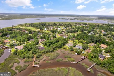 Nestled on a corner lot in the sought-after Oak Grove Island on Oak Grove Island Golf and Country Club in Georgia - for sale on GolfHomes.com, golf home, golf lot