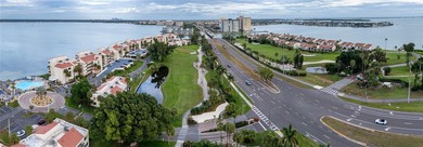 BIG Price IMPROVEMENT!! Step into paradise with this stunning on Isla Del Sol Yacht and Country Club in Florida - for sale on GolfHomes.com, golf home, golf lot