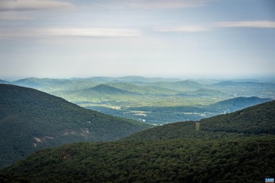 Perched at the highest point along Wintergreen's view ridge in on Devils Knob in Virginia - for sale on GolfHomes.com, golf home, golf lot