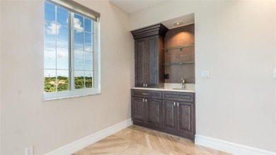 Experience true penthouse living in this exceptional top-floor on Palm-Aire Country Club and Resort - The Oaks in Florida - for sale on GolfHomes.com, golf home, golf lot