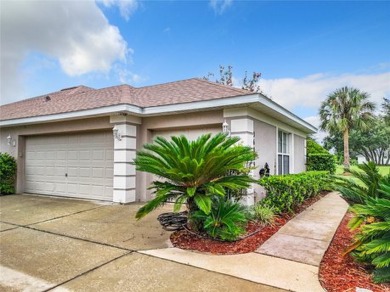 IN THE ESTATES OF BLACK BEAR RESERVE, A CHARMING HOME SITS ON on Black Bear Golf Club in Florida - for sale on GolfHomes.com, golf home, golf lot