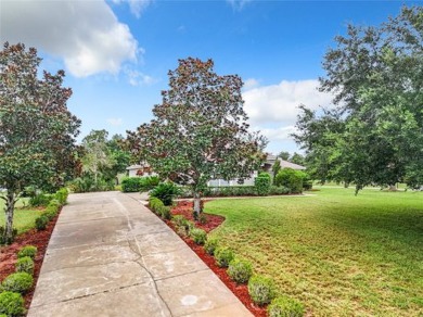 IN THE ESTATES OF BLACK BEAR RESERVE, A CHARMING HOME SITS ON on Black Bear Golf Club in Florida - for sale on GolfHomes.com, golf home, golf lot