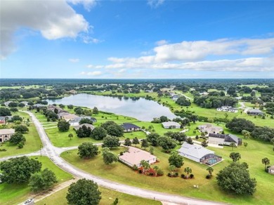 IN THE ESTATES OF BLACK BEAR RESERVE, A CHARMING HOME SITS ON on Black Bear Golf Club in Florida - for sale on GolfHomes.com, golf home, golf lot