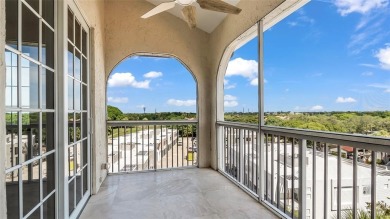 Experience true penthouse living in this exceptional top-floor on Palm-Aire Country Club and Resort - The Oaks in Florida - for sale on GolfHomes.com, golf home, golf lot
